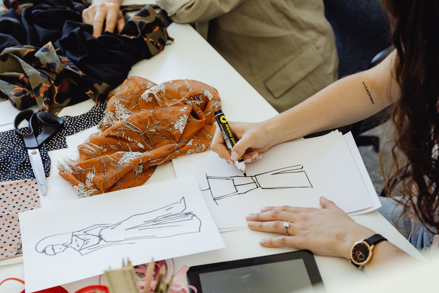 Close-up of designer drawing a fashion sketch Stock Photo - Alamy